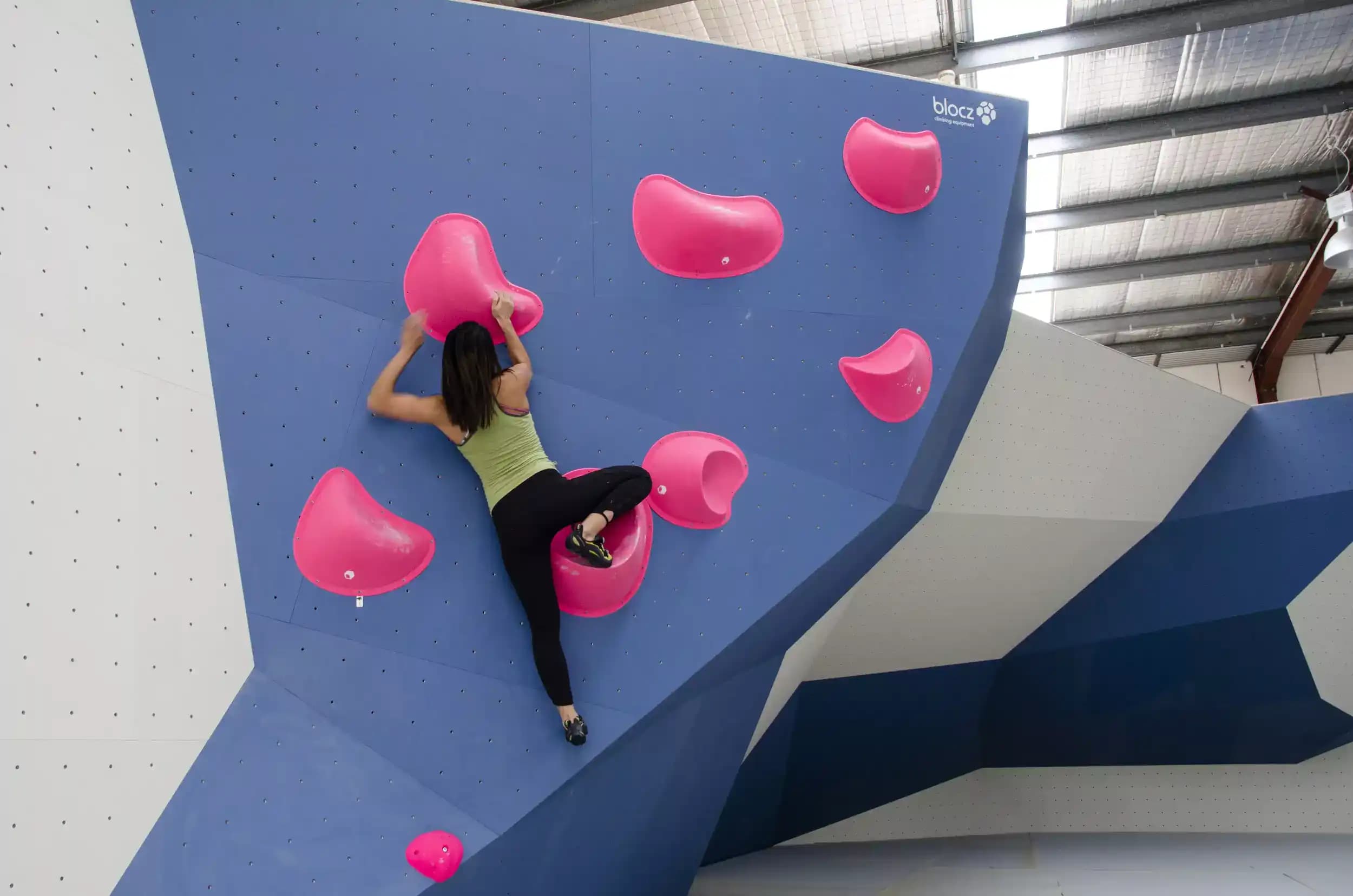 Woman climbing on a Pink route at Paramatta